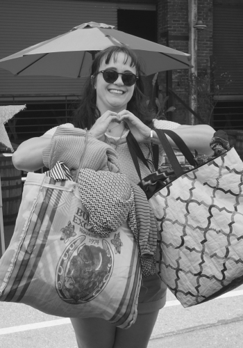 Raddie Baddie smiles with full bags of #FreeRackFinds